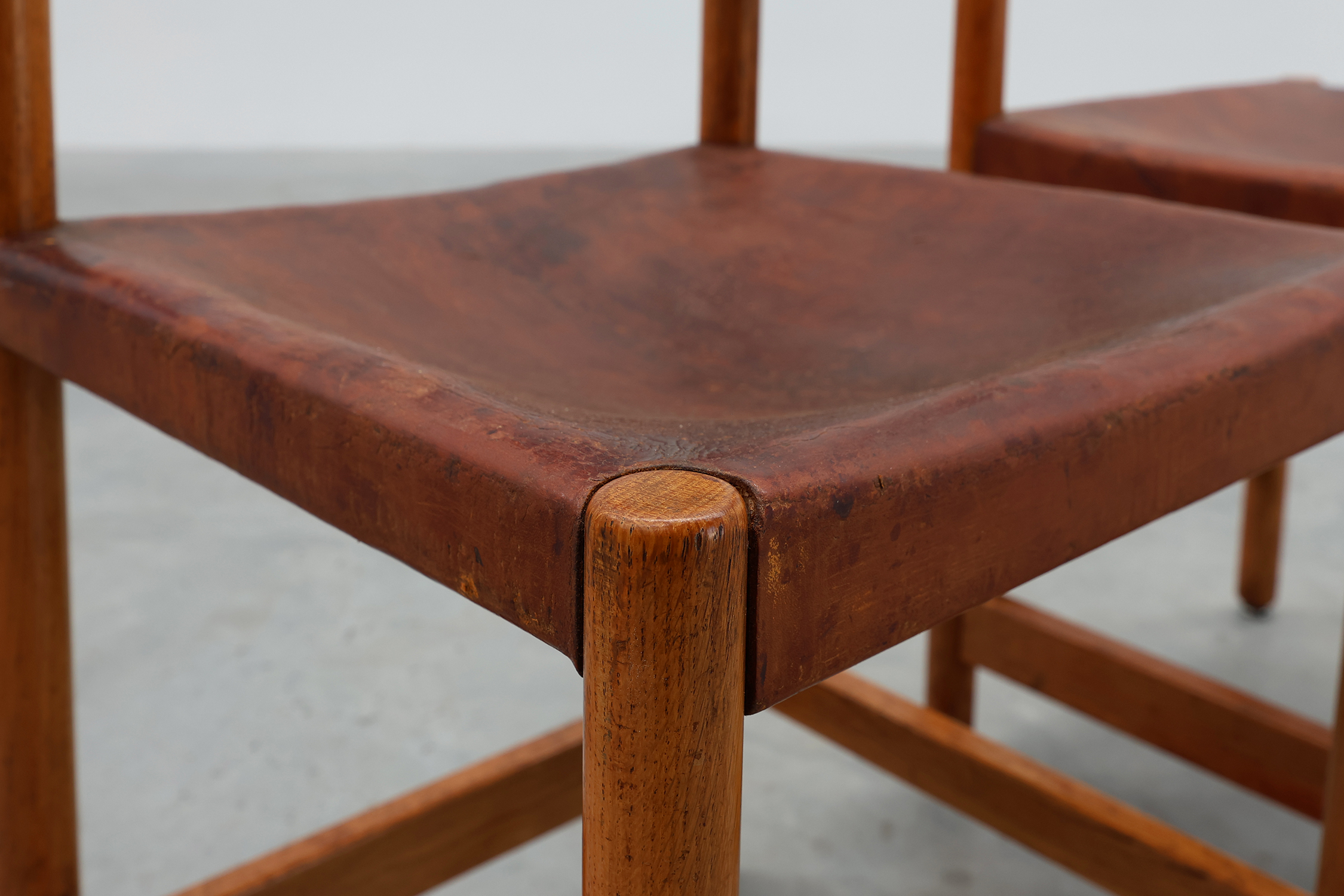 Pair of wood and leather Spanish chairs by Jordi Vilanova, ca. 1960thumbnail